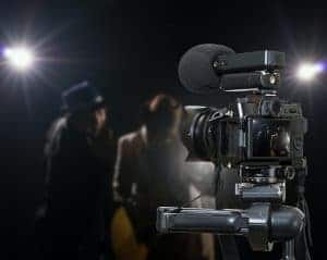 Professional digital Mirrorless camera with microphone recording video blog of Musician